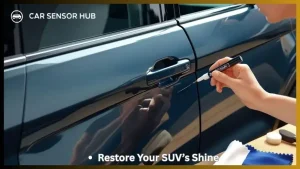 Person repairing paint scratch on Ford Explorer with touch‑up pen