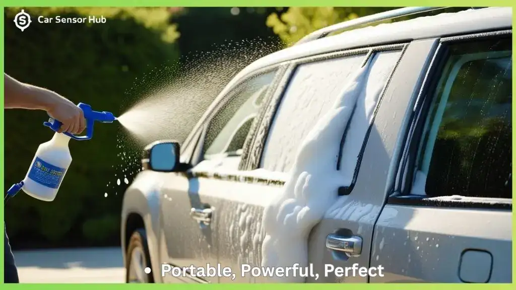 Person cleaning silver SUV using a portable foam gun in driveway