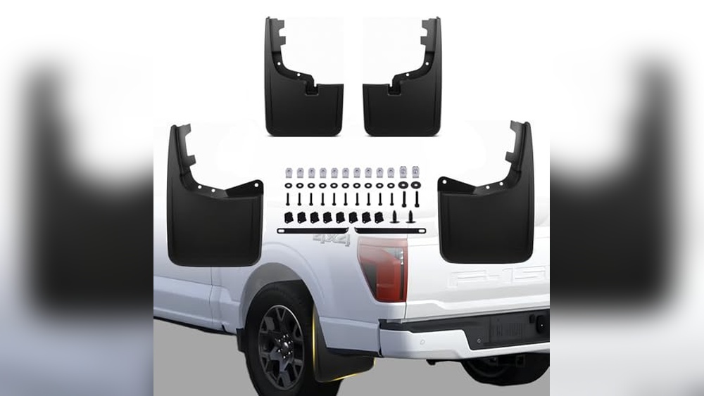 Heavy-duty Gatorback mud flaps with stainless steel plates installed on a Ford F-150 4X4 for off-road protection.
