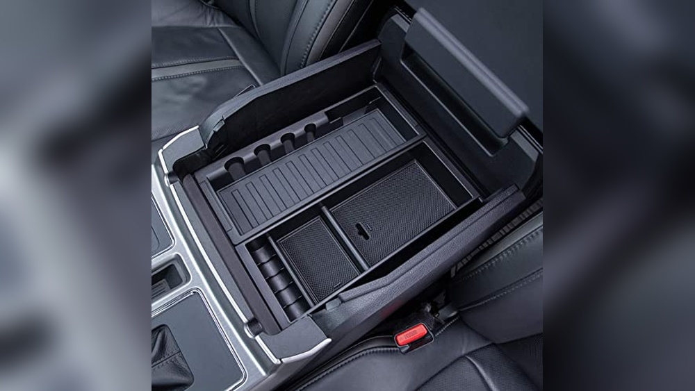 A high-quality ABS plastic organizer tray inserted into the deep center console of a Ford F-150 pickup truck.