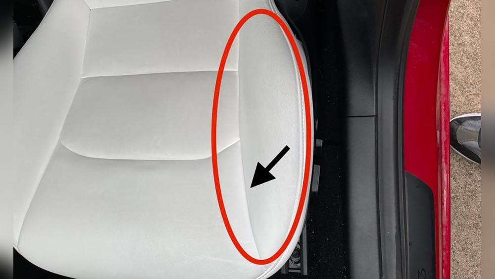 Clean Tesla Model Y White Seats using a microfiber cloth on Tesla vegan leather interior