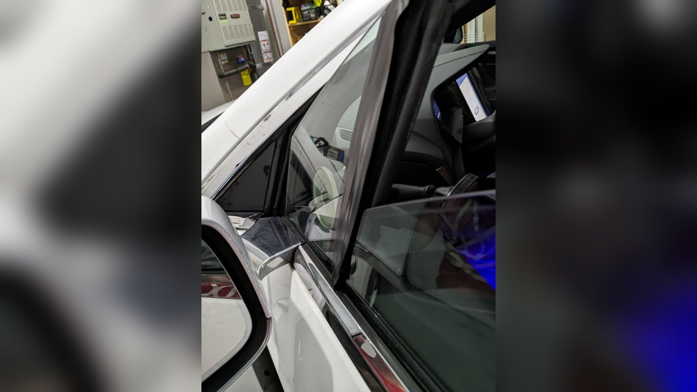 Fix Tesla Model Y Window Noise showing window seal and glass alignment on a Tesla Model Y door
