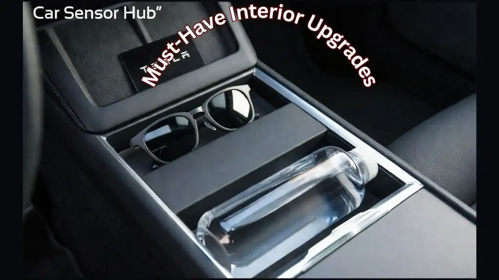 A custom-fit sliding center console organizer tray installed in a 2026 Tesla Model 3 Highland, showing two-tier storage.