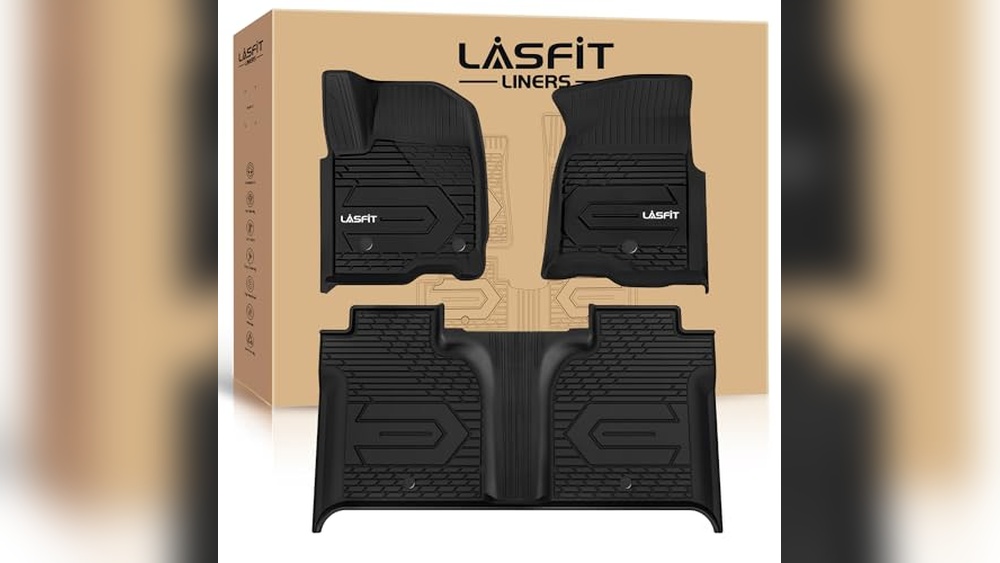 A custom-fit TuxMat floor liner installed in a GMC Sierra 1500 Denali, providing edge-to-edge protection for the luxury truck interior.