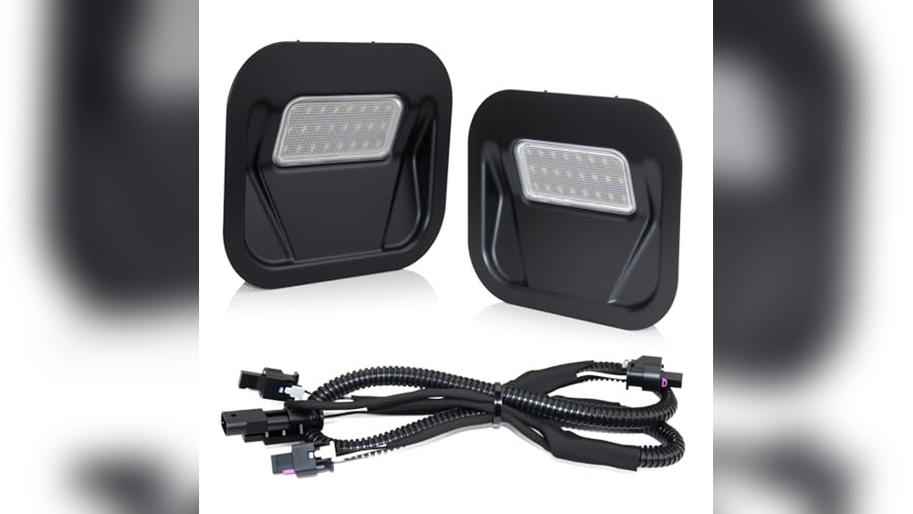 GMC Sierra 1500 Multipro Tailgate Step Light illuminating the tailgate step at dusk for safer access