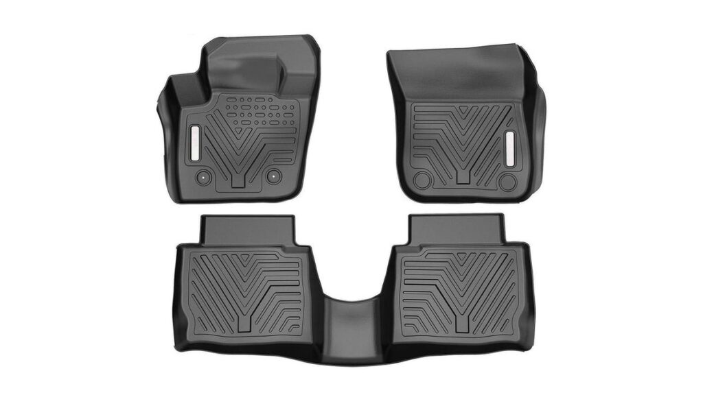 A set of durable all-weather rubber floor mats inside a modern Ford Fusion vehicle.