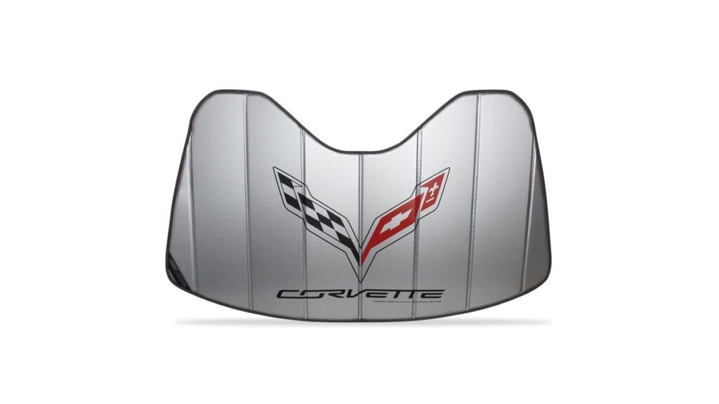 A C7 Corvette parked in a driveway with a sun shade protecting the dashboard.