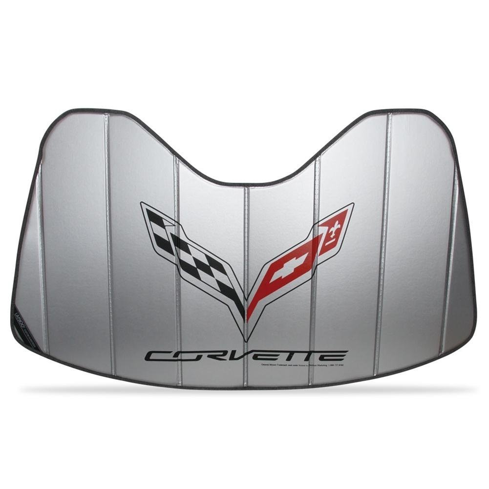 A C7 Corvette parked in a driveway with a sun shade protecting the dashboard.