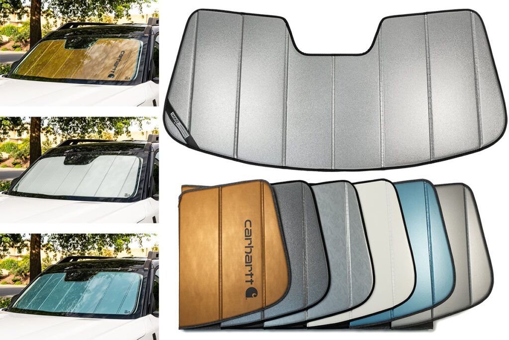 A custom fit windshield sunshade installed inside a Ford Fusion on a sunny day.