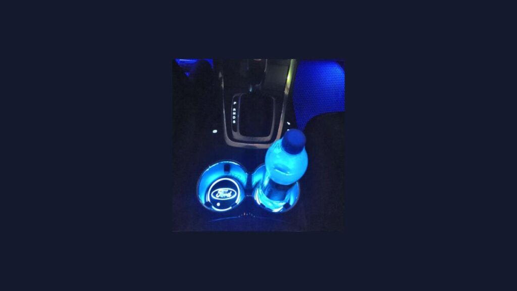 Custom silicone cup holder inserts installed in the center console of a car.