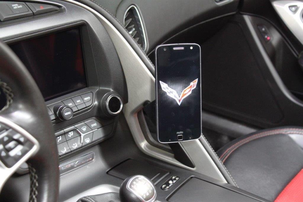 A sleek phone mount attached to the interior dashboard of a C7 Corvette.