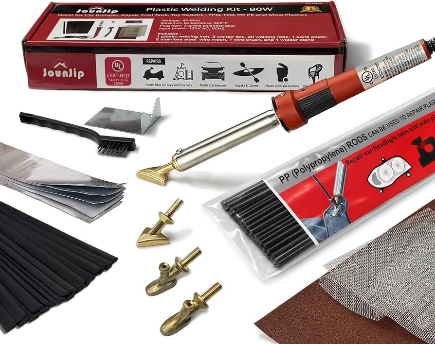 Automotive plastic soldering kit with welding tool and repair staples on workbench