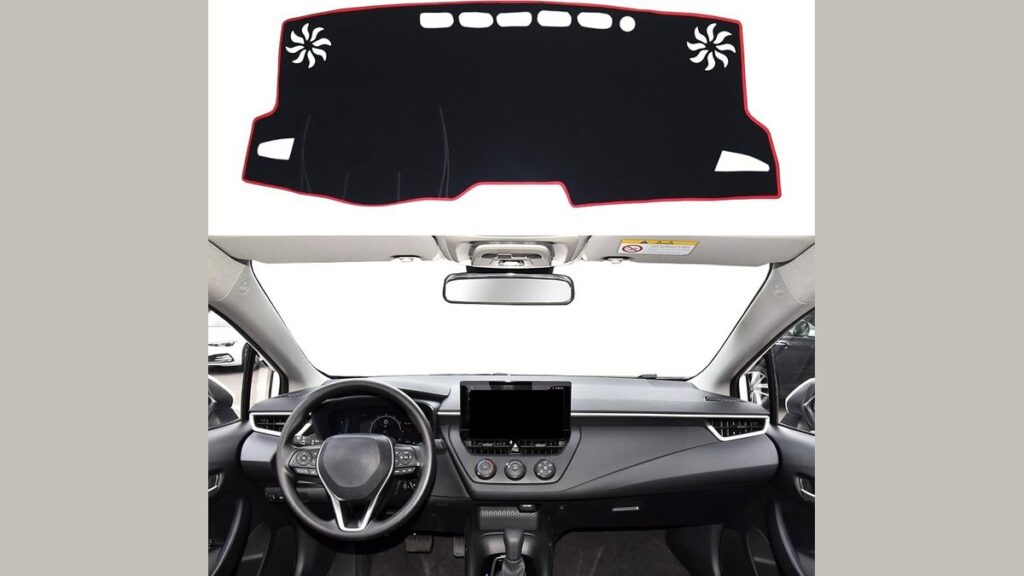 Black dashboard cover installed on a Toyota Corolla in a bright garage.