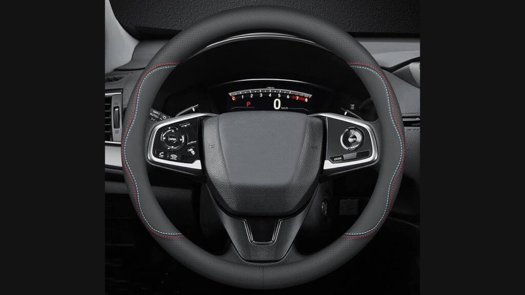 Black leather steering wheel cover installed on a Toyota Corolla inside a bright car interior.
