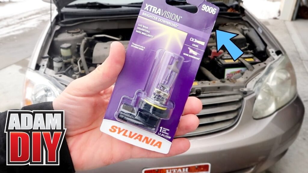 A bright LED fog light bulb glows on a modern Toyota Corolla bumper.