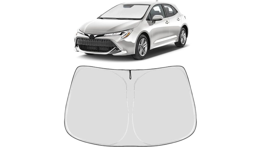 Custom windshield sunshade fitted inside a Toyota Corolla parked in a sunny driveway