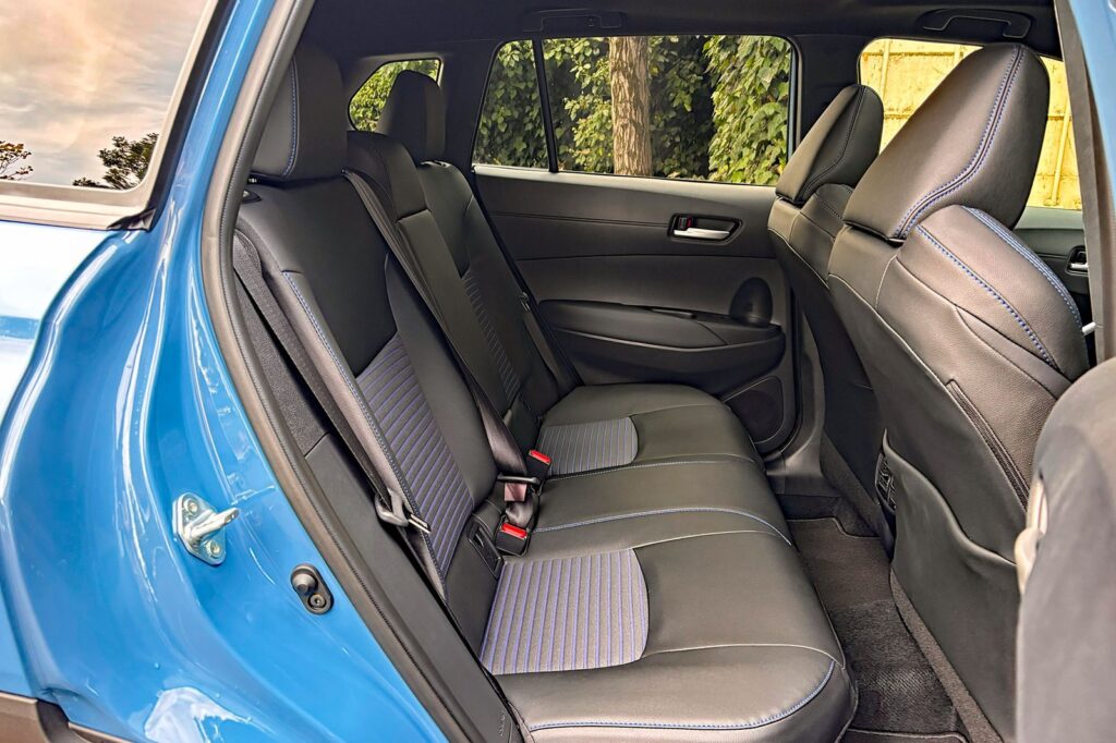 Fabric back seat organizer hanging on a Toyota Corolla rear seat.