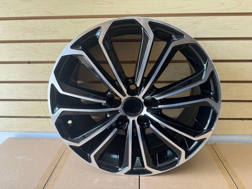 Four hubcentric wheel rings for a Toyota Corolla on a workbench