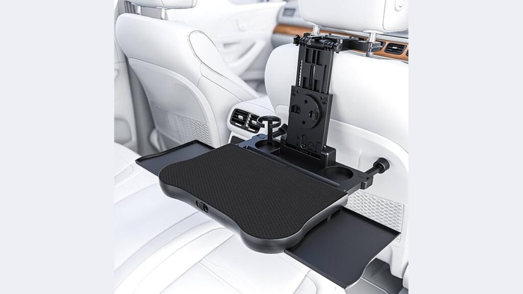 A functional back seat travel tray installed in a modern Toyota Corolla vehicle.
