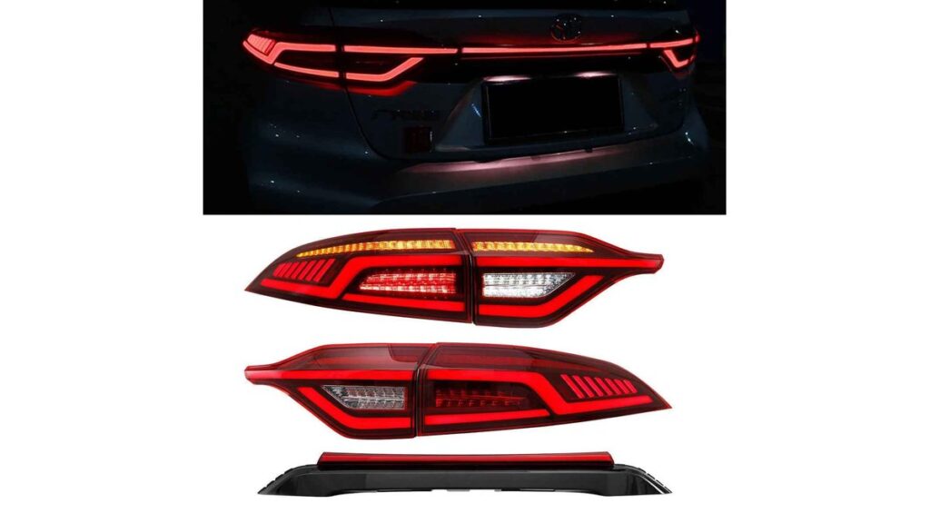 A glowing LED tail light illuminates the rear of a modern Toyota Corolla.