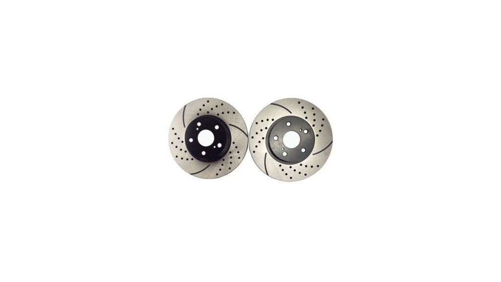 A high-performance brake rotor sits on a workbench for Toyota Corolla maintenance.