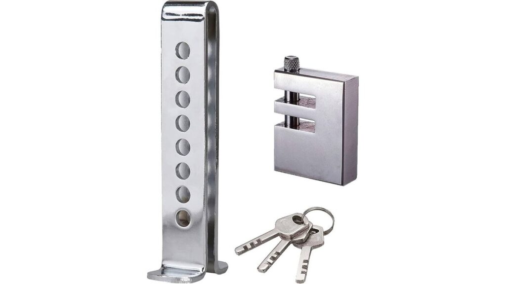 Metal anti-theft lock secured on Ford Fusion brake pedal in garage