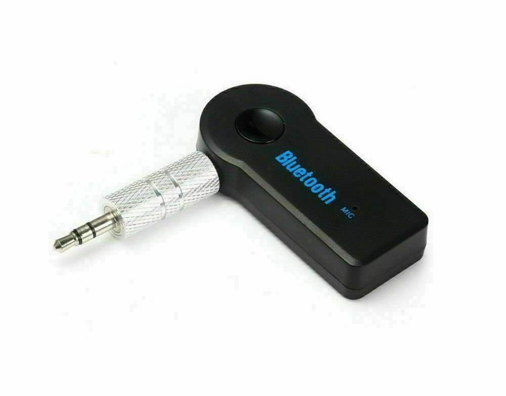 A modern car bluetooth adapter plugged into a vehicle dashboard for seamless audio streaming.