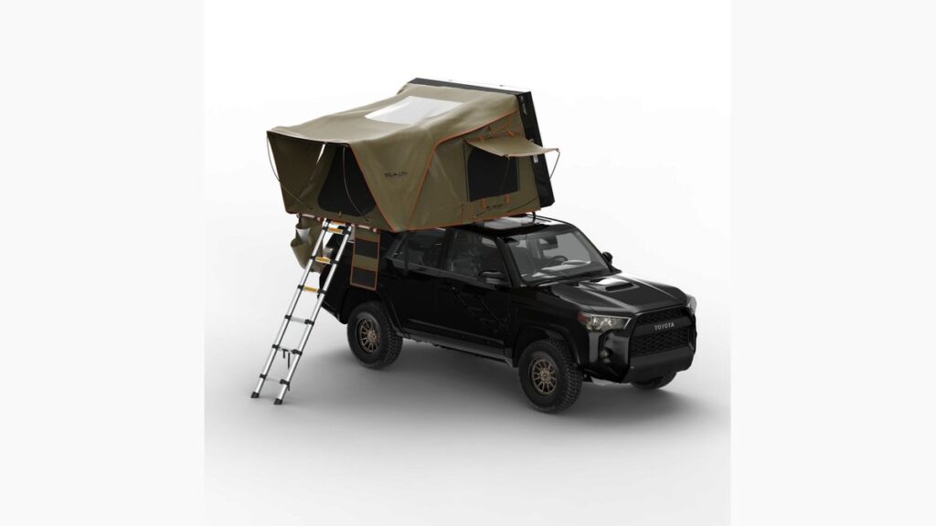 A rugged SUV with a hard-shell rooftop tent parked on a mountain ridge.