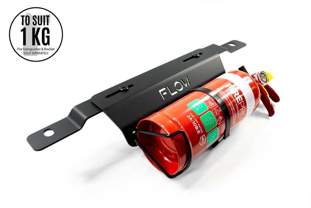 A secure fire extinguisher bracket installed inside a modern Toyota Corolla vehicle cabin.