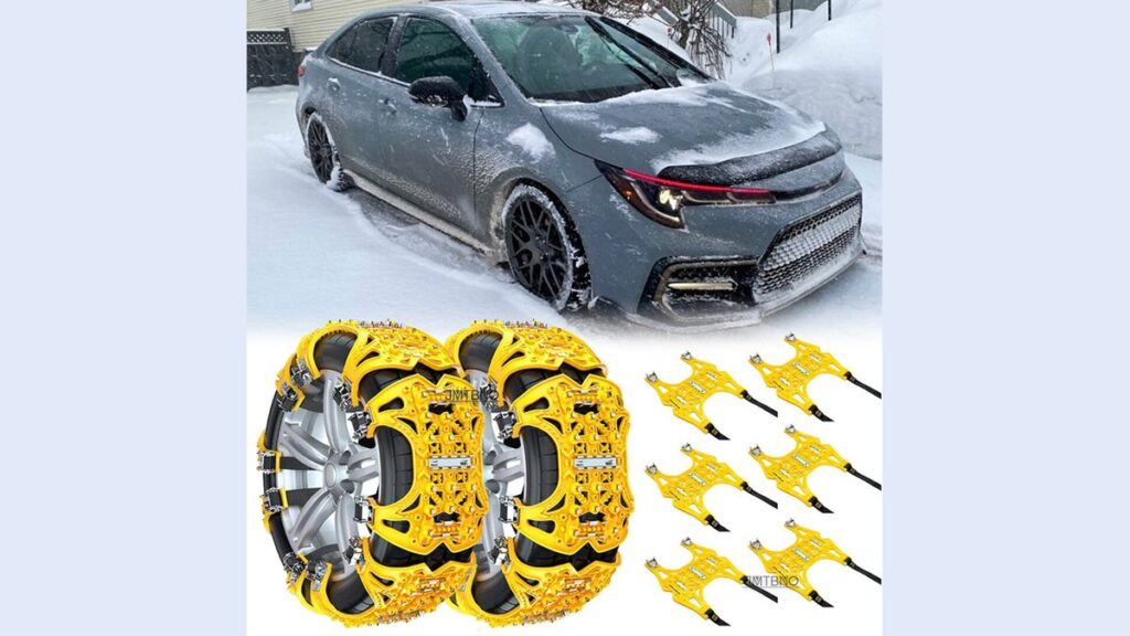 Snow tire chains beside a silver Toyota Corolla on a snowy driveway