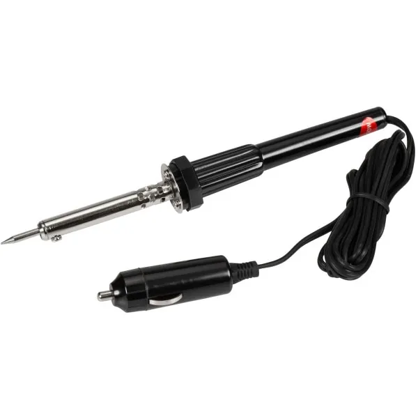 Soldering iron on a wire joint with melted insulation on a workbench