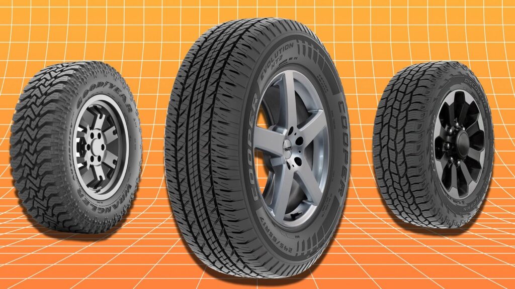 Stacked new car tires with alloy wheel in a bright auto shop