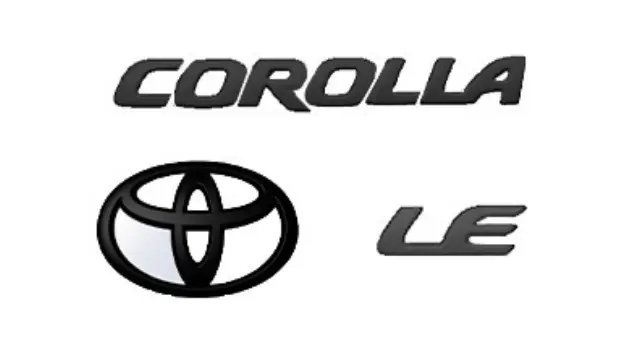 Toyota Corolla with blackout emblem overlay on front grille in natural light