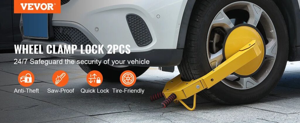 Yellow wheel clamp lock secured to Ford Fusion tire outdoors
